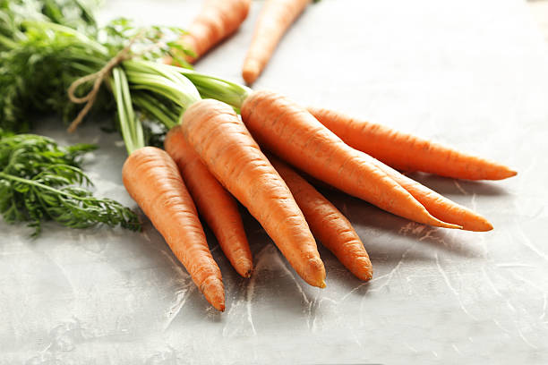 istock Fresh and sweet carrots on a grey table 601903068