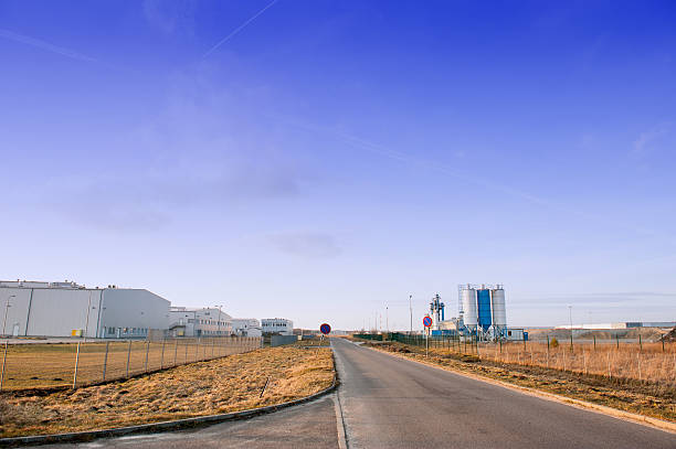 istock Modern industrial building over blue sky 601905218
