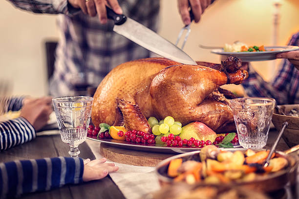 istock Carving Traditional Stuffed Turkey for Dinner 601907766