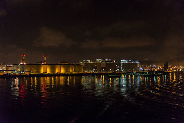 istock Gas and fuel tanks at night 601908158