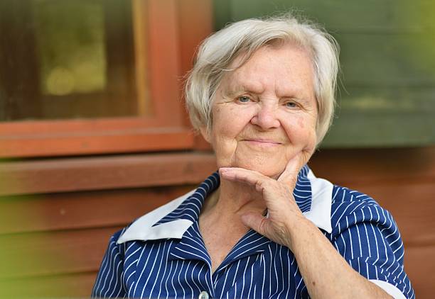 istock Senior smiling woman in garden. 601909592