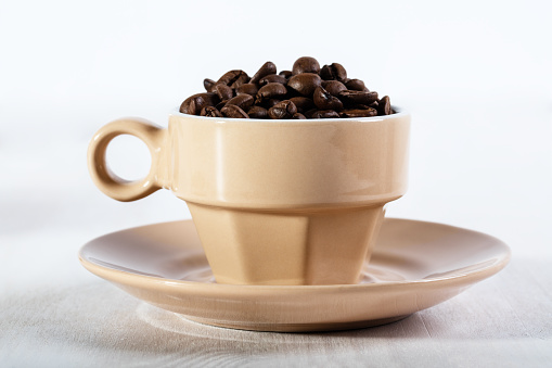 Coffee seed in beige cup.