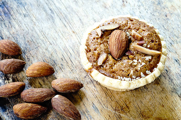 istock Homemade Almonds tart on wooden table background 601912816