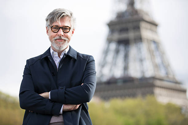 istock Middle aged man traveling near the eiffel tower. 601913518