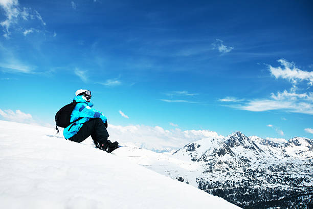 Snowboarder enjoying the nature in mountains stock photo