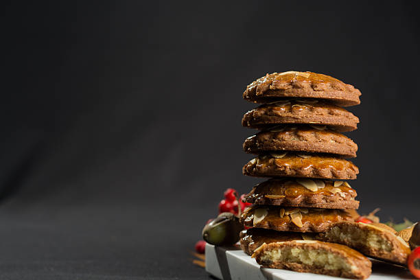 istock Typical Dutch filled spicy  cookies with almonds on autumn color 601914576