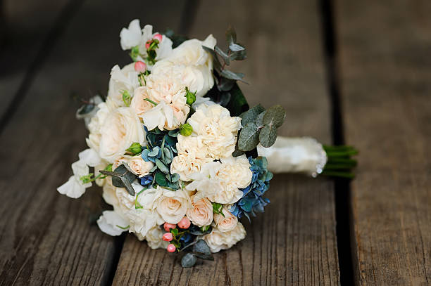 istock bridal bouquet on wooden background 601915574