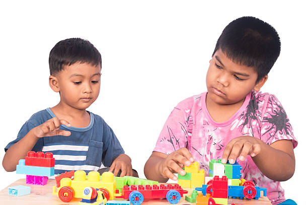 istock little asian boy play building brick 601916176