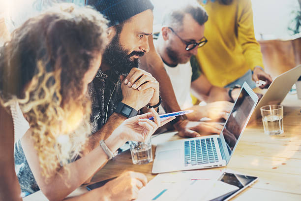 istock Group Modern Young Business People Gathered Together Discussing Creative Project 601916196