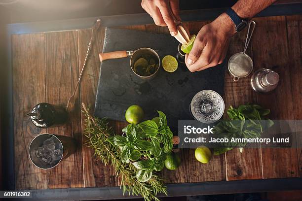 Bartender Experimenting With Creating New Cocktails Stock Photo - Download Image Now