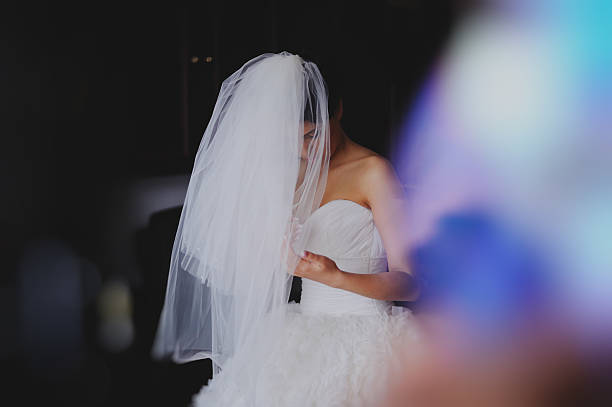 istock Beautiful bride in wedding dress getting ready 601916674