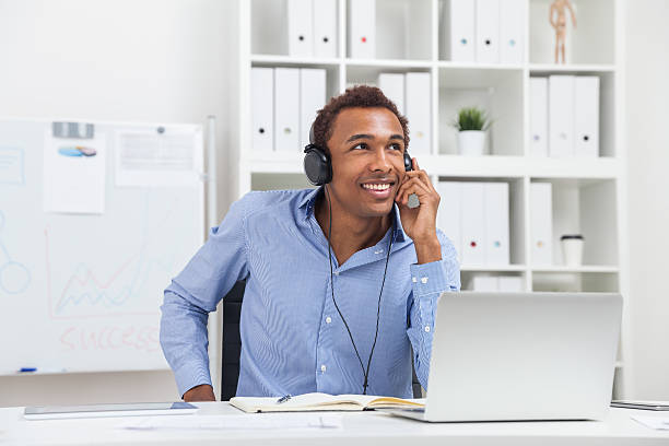istock Smiling man listening to music 601916988