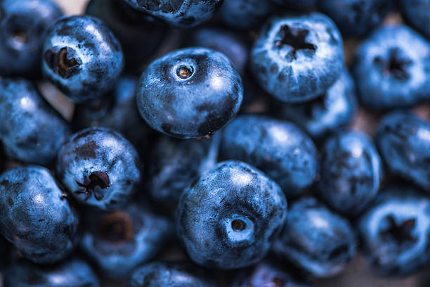 istock Blueberries on wooden background, macro close up 601917408