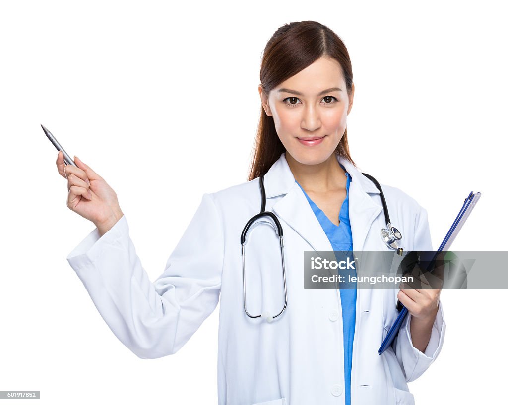 Female doctor holding a clipboard and pointing Doctor Stock Photo