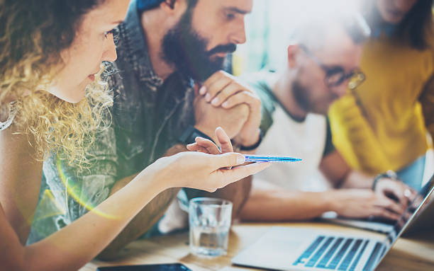 istock Closeup Group Modern Friends Gathered Together Discussing Creative Project.Young 601917944