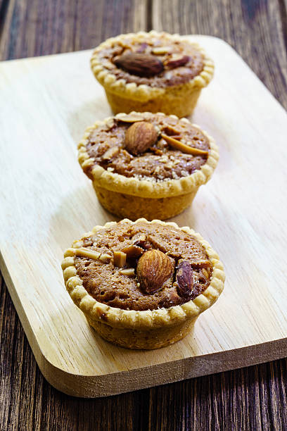 istock Homemade Almonds tart on wooden table background 601919210