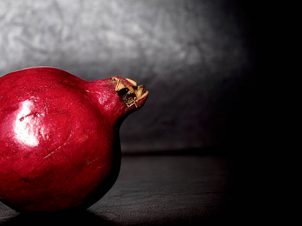 Pomegranate on black background
