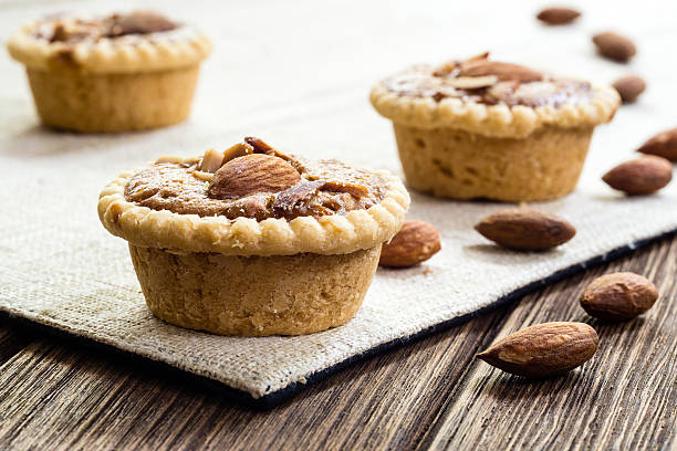 istock Homemade Almonds tart on wooden table background 601920048