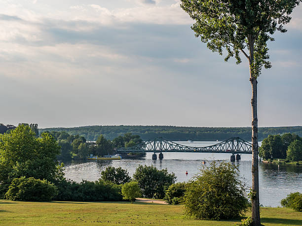 istock sunset over a park with lake and bridge in background 601921348