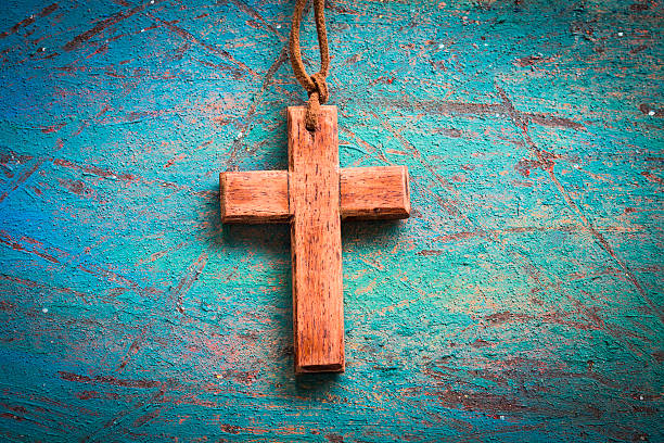 istock wooden cross on blue retro background 601921676