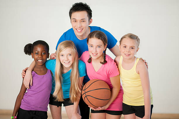 istock Girls Learning to Play Basketball 601922230