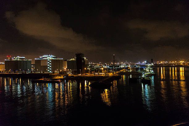 istock Gas and fuel tanks at night 601922246