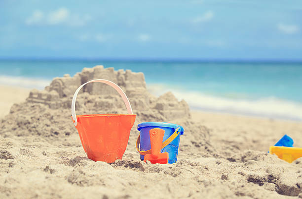 istock kids play on beach concept 601922260