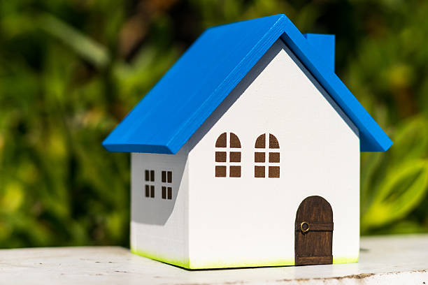 istock Home image, blue house toy under blue sky 601922792