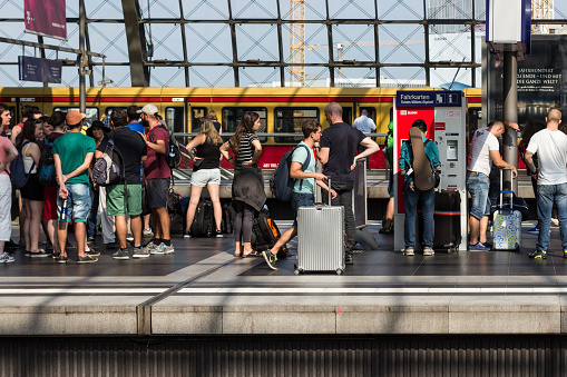 Berlin, Germany - September 9, 2016: Traveler people waiting for train on platform at main train station ( Hauptbahnhof ) Berlin.
