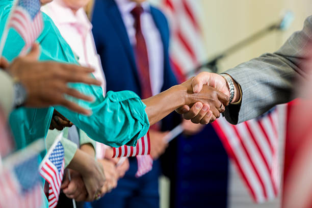 istock Local candidate shaking supporter's hand during political rally 601923384