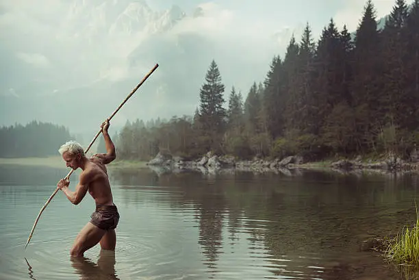 Barbarian man fishing in the lake