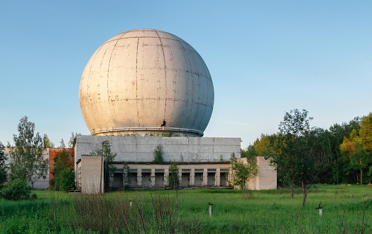 Old giant dome of a radar antenna of a Russian military base