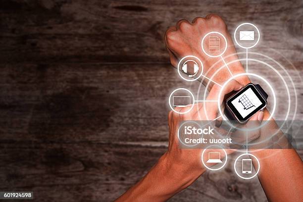 Using Smart Watch For Omnichannel Stock Photo - Download Image Now - Omnichannel, Paying, Watch - Timepiece