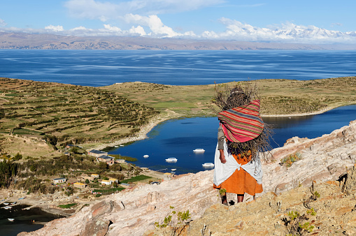Bolivia - Isla del Sol on the Titicaca lake, the largest highaltitude lake in the world (3808m) This island's legendary Inca creation site and the birthplace of the sun. Native women return to the village