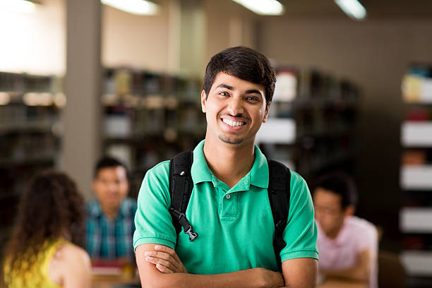 istock Nepalese student with arms crossed and smiling at camera 601925856