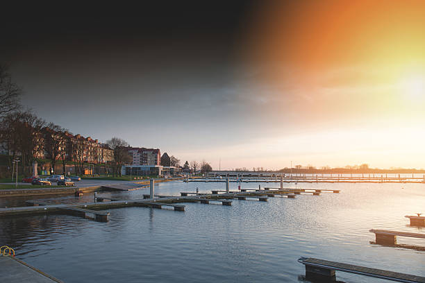 istock Yacht port over orange sunset 601928924