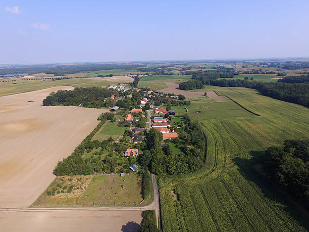 istock aerial view of a small village on agriculture fields 601930478