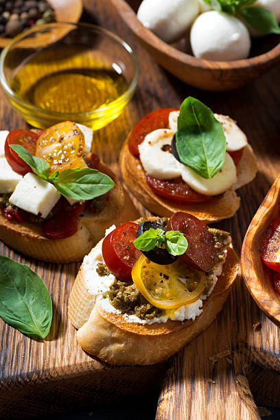 istock delicious Italian appetizers - various bruschettas, closeup 601930848