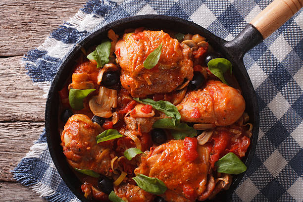 istock Cacciatori Chicken with black olives close-up in a pan. horizontal 601931132