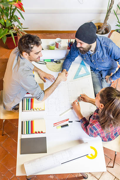istock overhead view of people working together from above 601931384