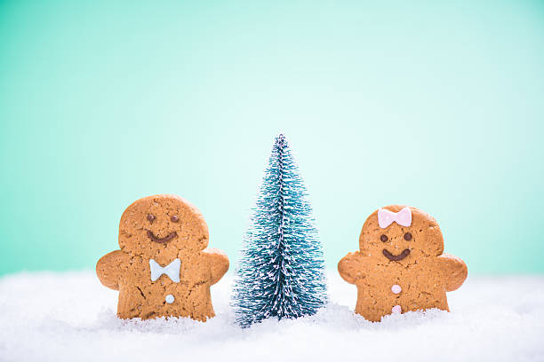 istock Kids enjoy Christmas tree in snow 601931564