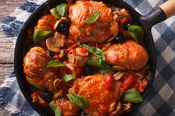 istock Cacciatori Chicken with mushrooms closeup in a pan. horizontal 601931866