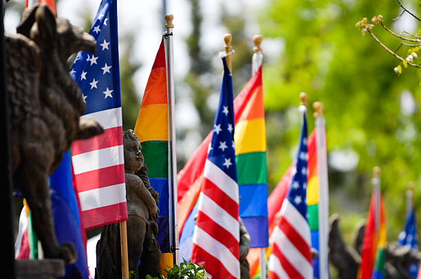 istock American and Rainbow flags flying together 601931896