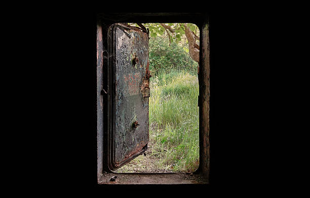 istock Open the door of the old bunker 601932050