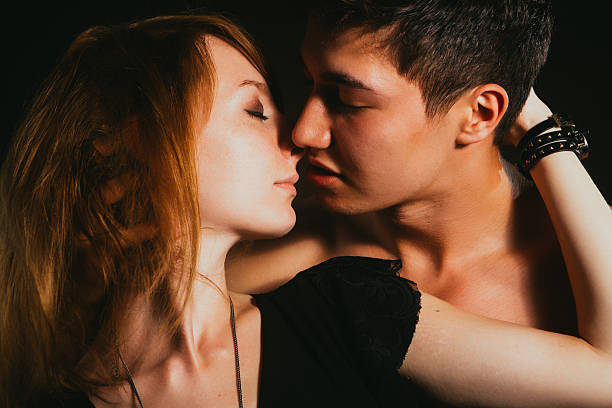 istock Young beautiful couple in each other's arms 601932826