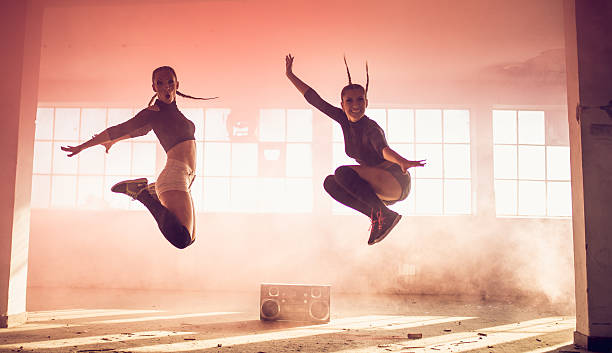 istock Women jumping in pink smoke 601933210