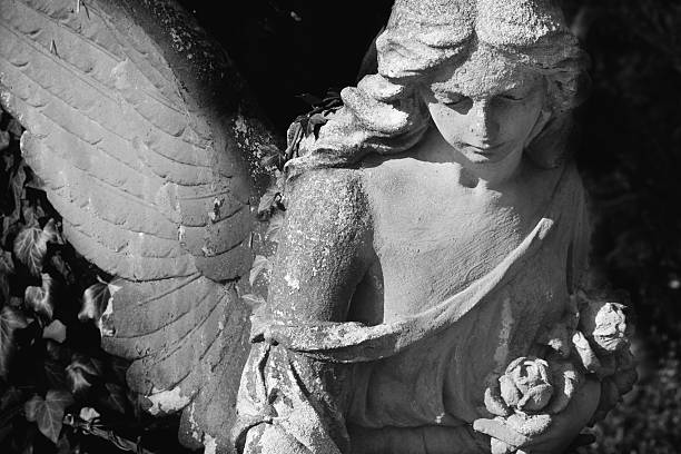 istock Vintage image of a sad angel on a cemetery 601933256
