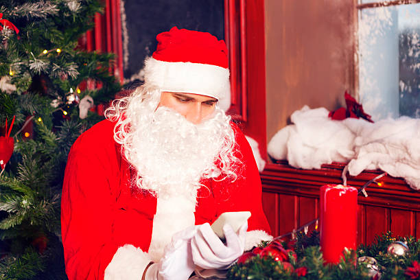 istock Santa Claus using a smart phone 601935426