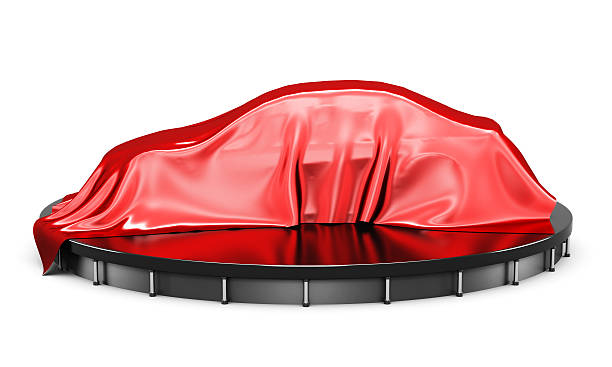 istock Car on the podium covered with a red satin cloth 601936328