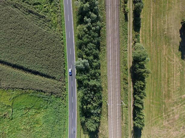 istock aerial view country road next to a railway line 601937276